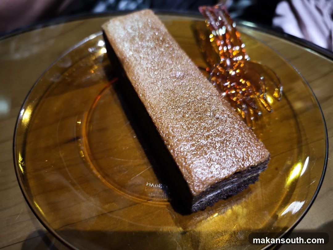 Chocolate Cake Slice on Amber Plate