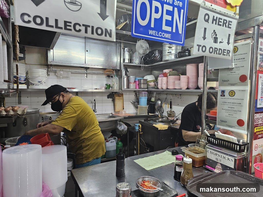 Kitchen Interior with Staff Preparing Food
