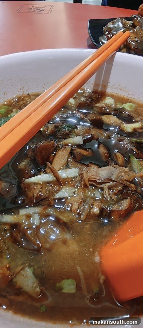 Bowl of Soup with Chopsticks