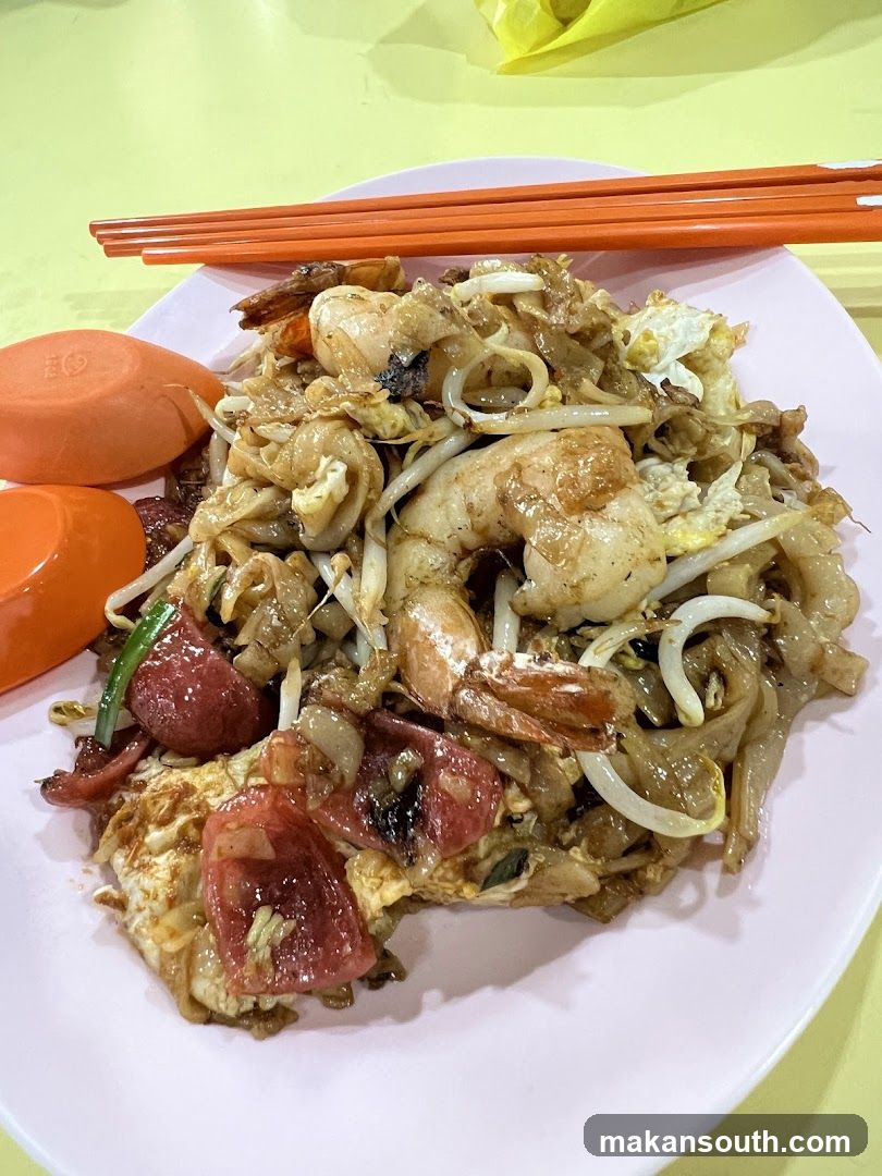 Plate of Stir-fried Noodles with Shrimp and Sausage