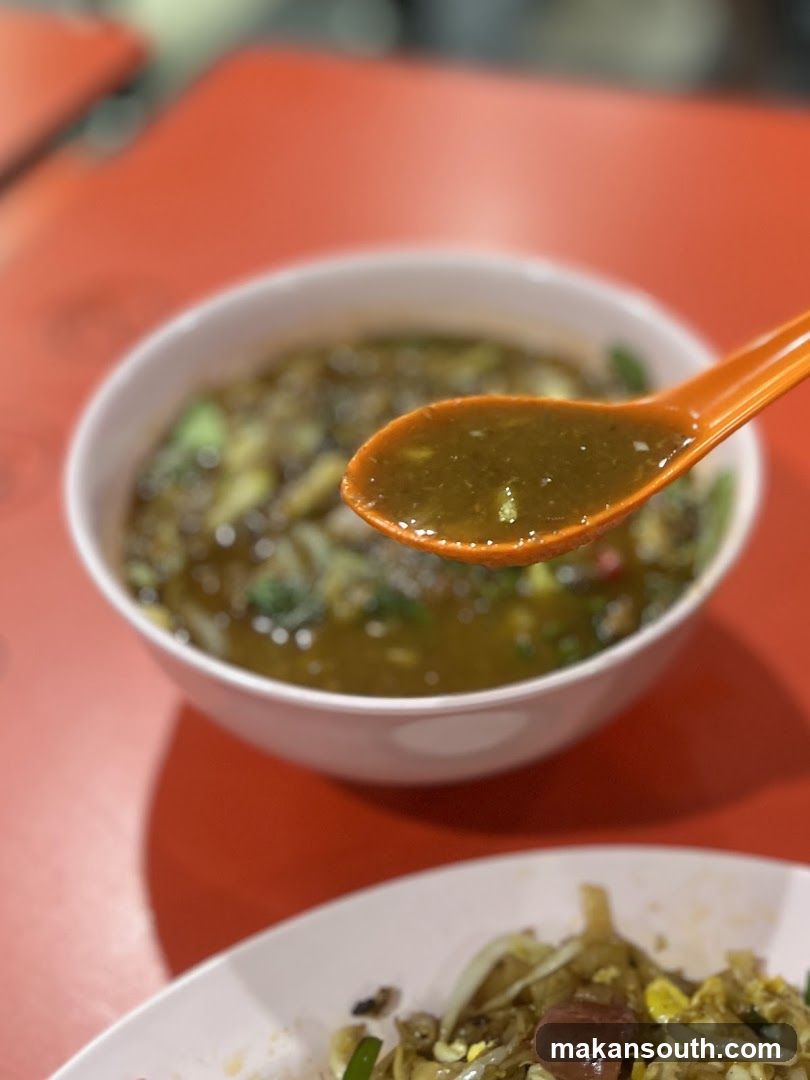 Bowl of Soup with Spoon