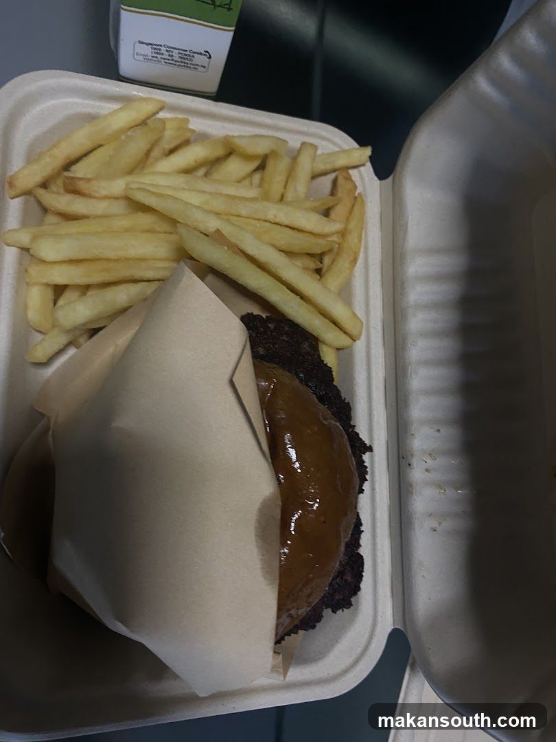 Burger and Fries in Takeout Container