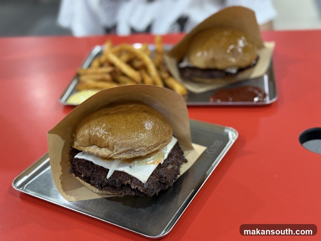 Burgers and Fries on Metal Trays
