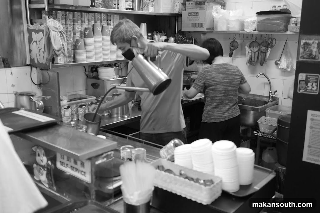 Kitchen Interior with Staff Preparing Food