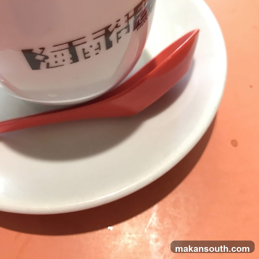 Cup and Spoon on Saucer