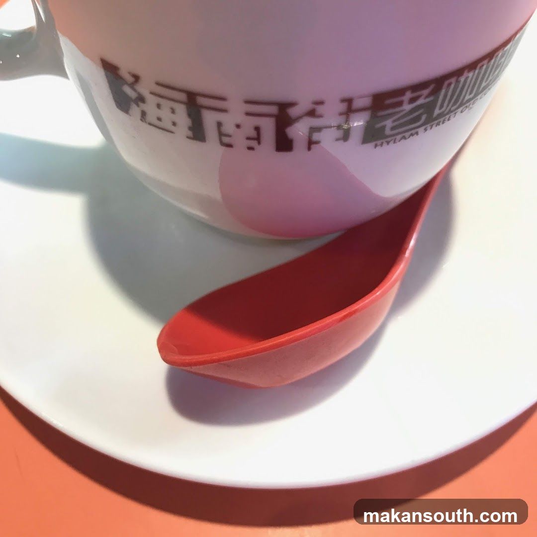 Coffee Cup with Red Spoon