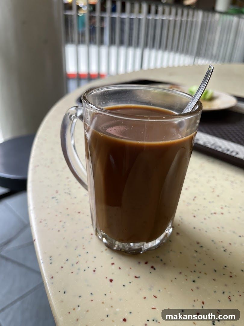Coffee in a glass mug on speckled table