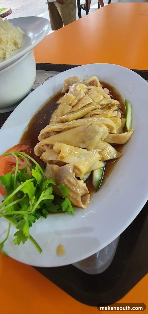 Chicken dish with rice and garnish