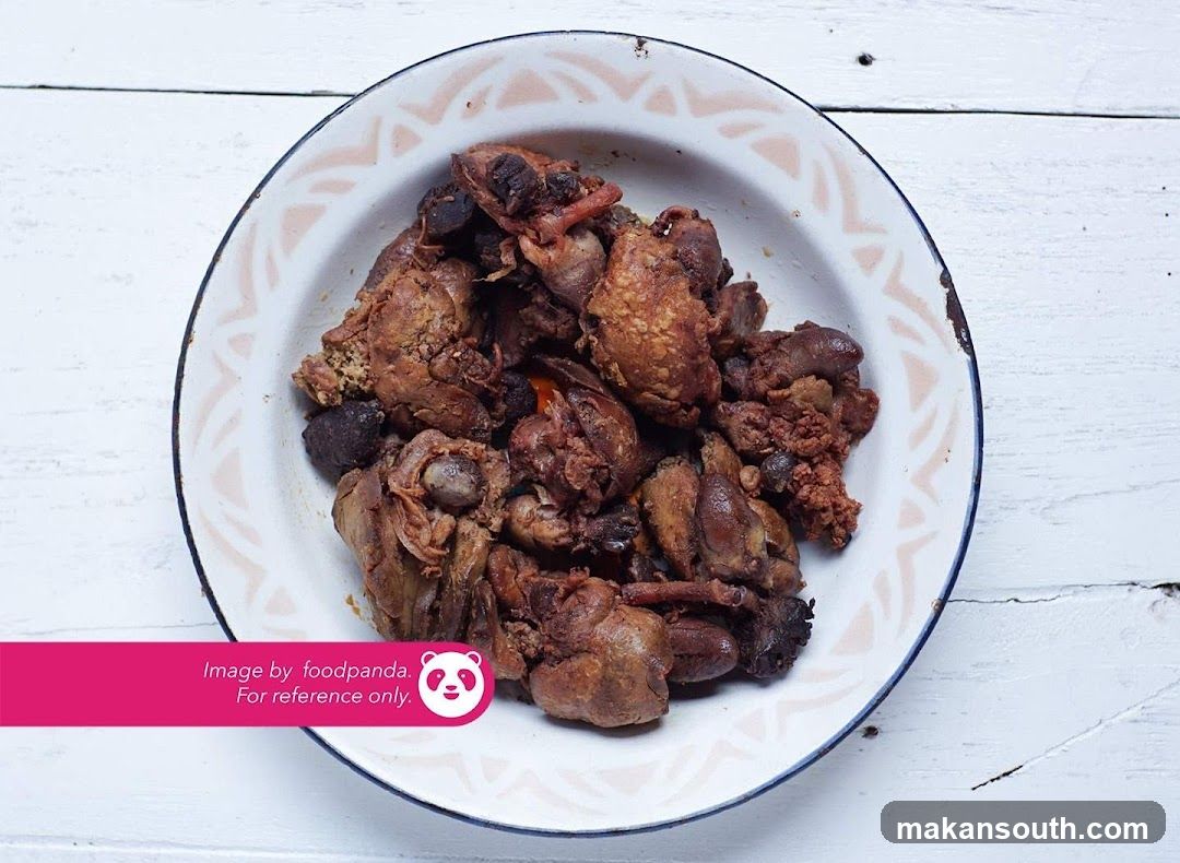 Bowl of cooked chicken pieces