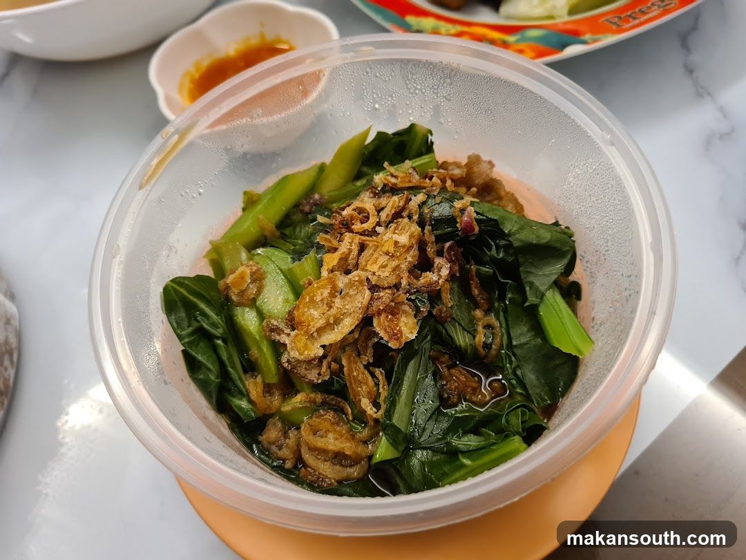 Bowl of stir-fried greens with fried shallots