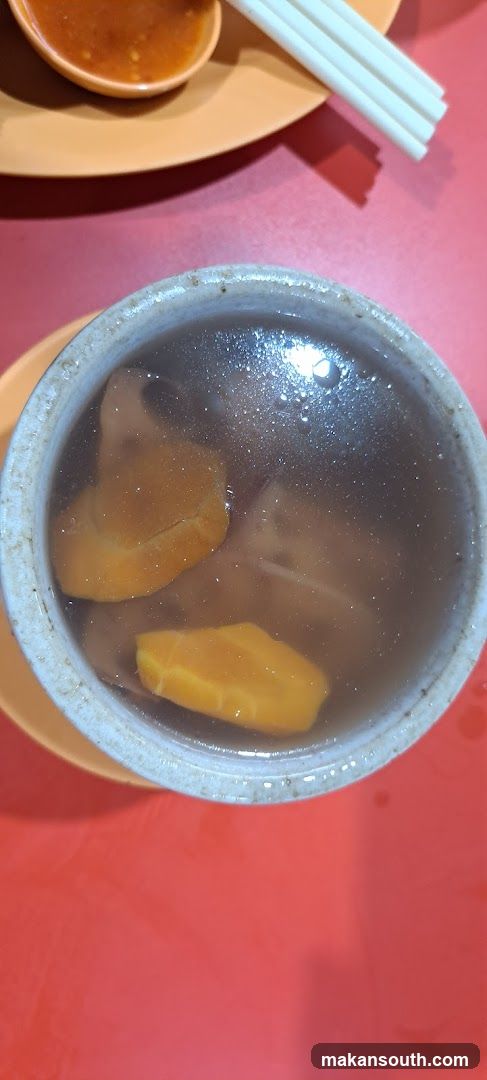 Bowl of Soup with Mango Slices