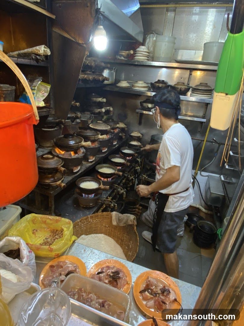 Kitchen Scene with Cooks and Dishes