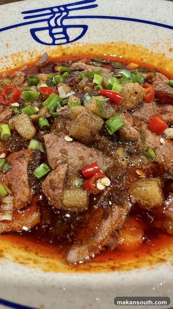 Spicy Meat Dish with Chili and Scallions