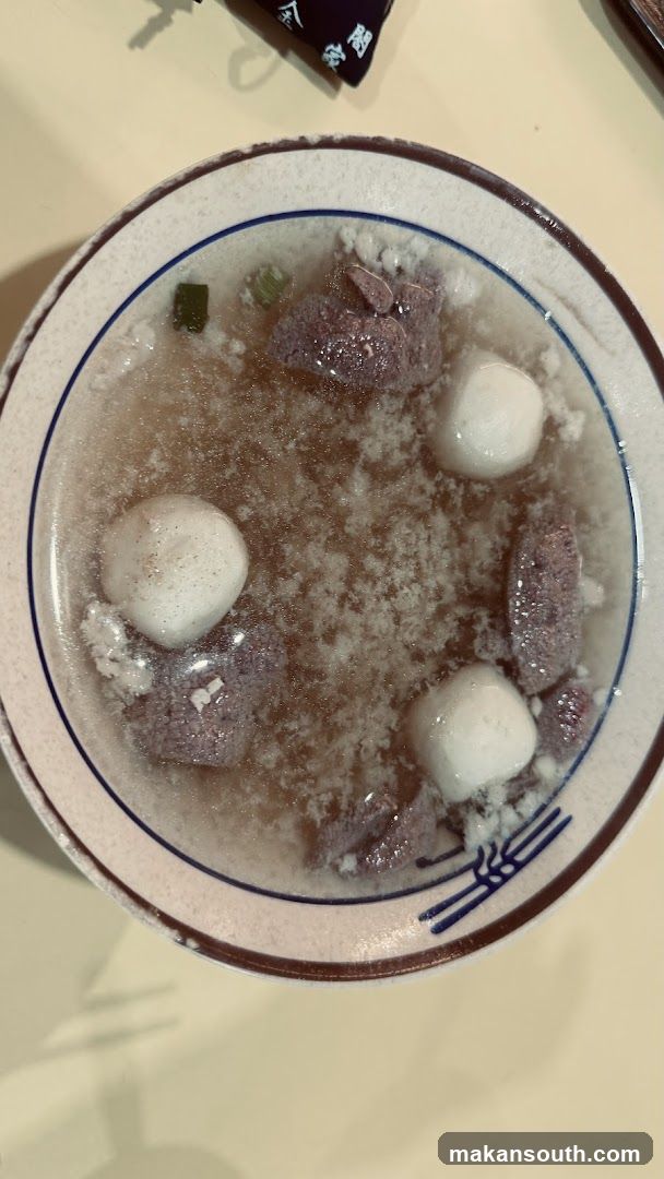 Bowl of Soup with Meatballs and Blood Cured Pork