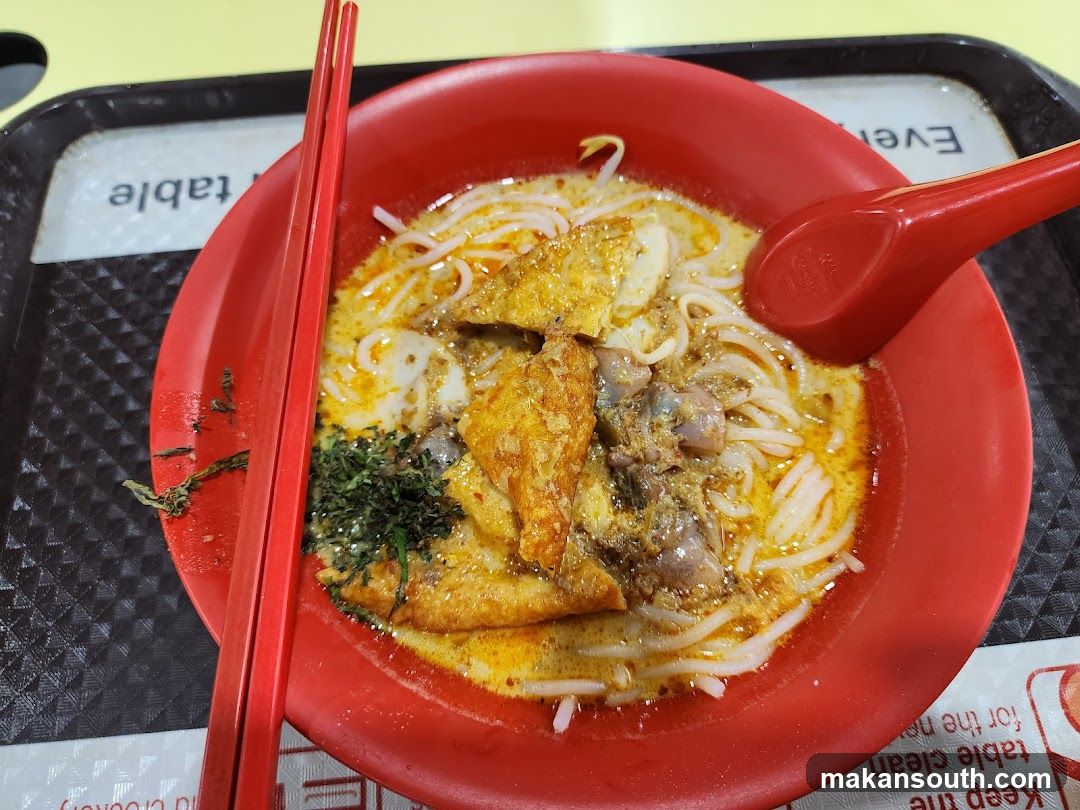 Red Bowl of Noodles with Tofu and Meat