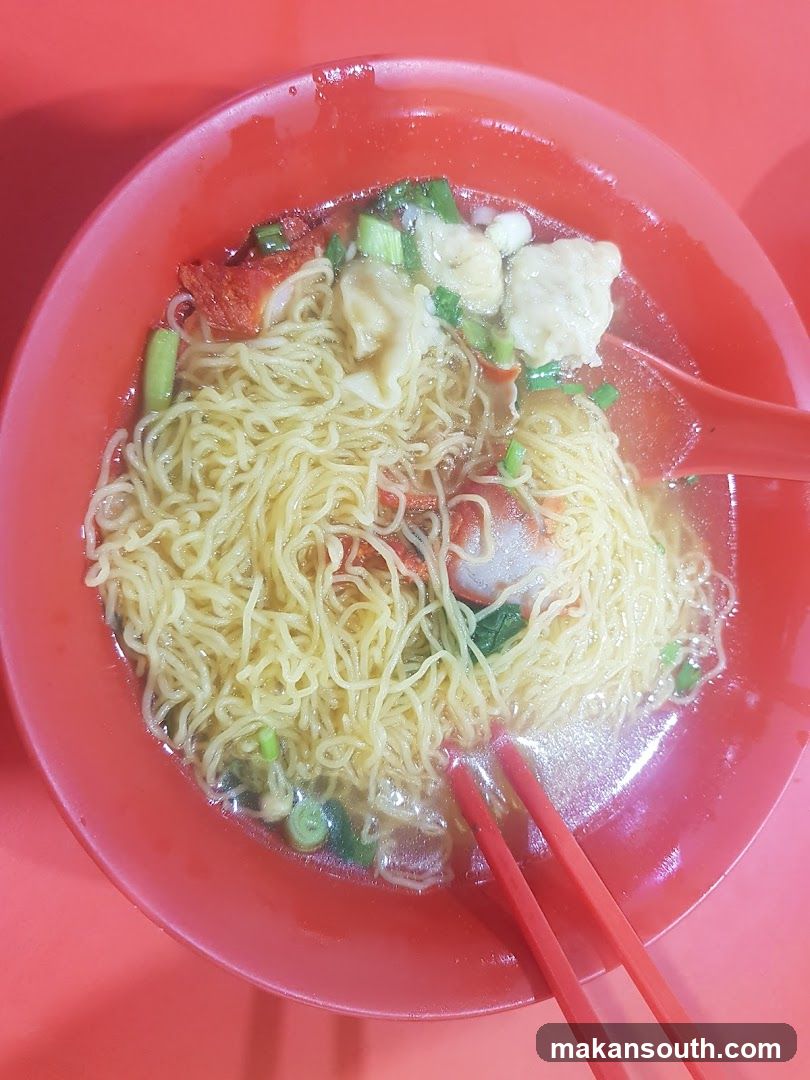Bowl of Noodles with Chopsticks and Spoon
