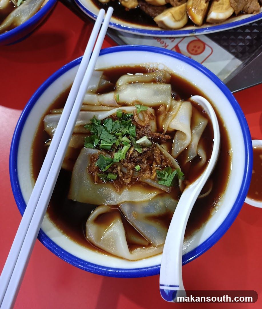 Bowl of Noodle Soup with Garnish