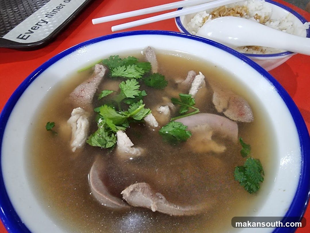 Bowl of Soup with Meat and Cilantro