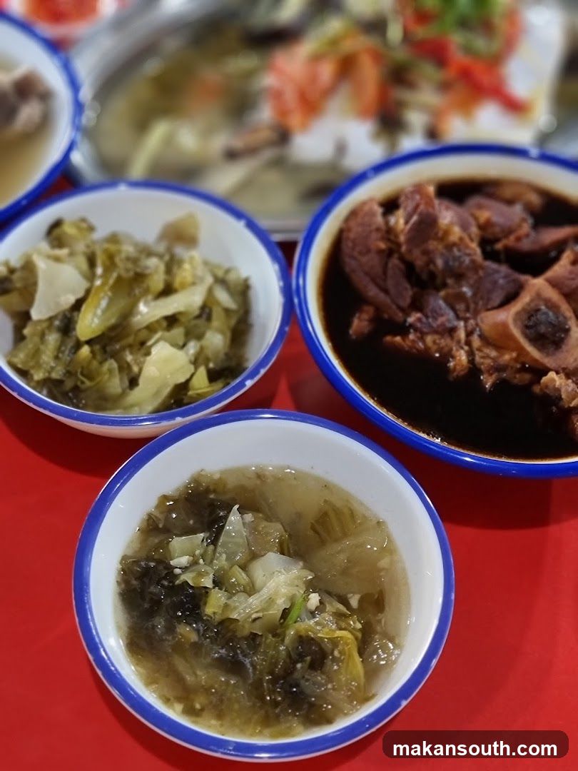 Bowl of food with pickled vegetables and stewed meat