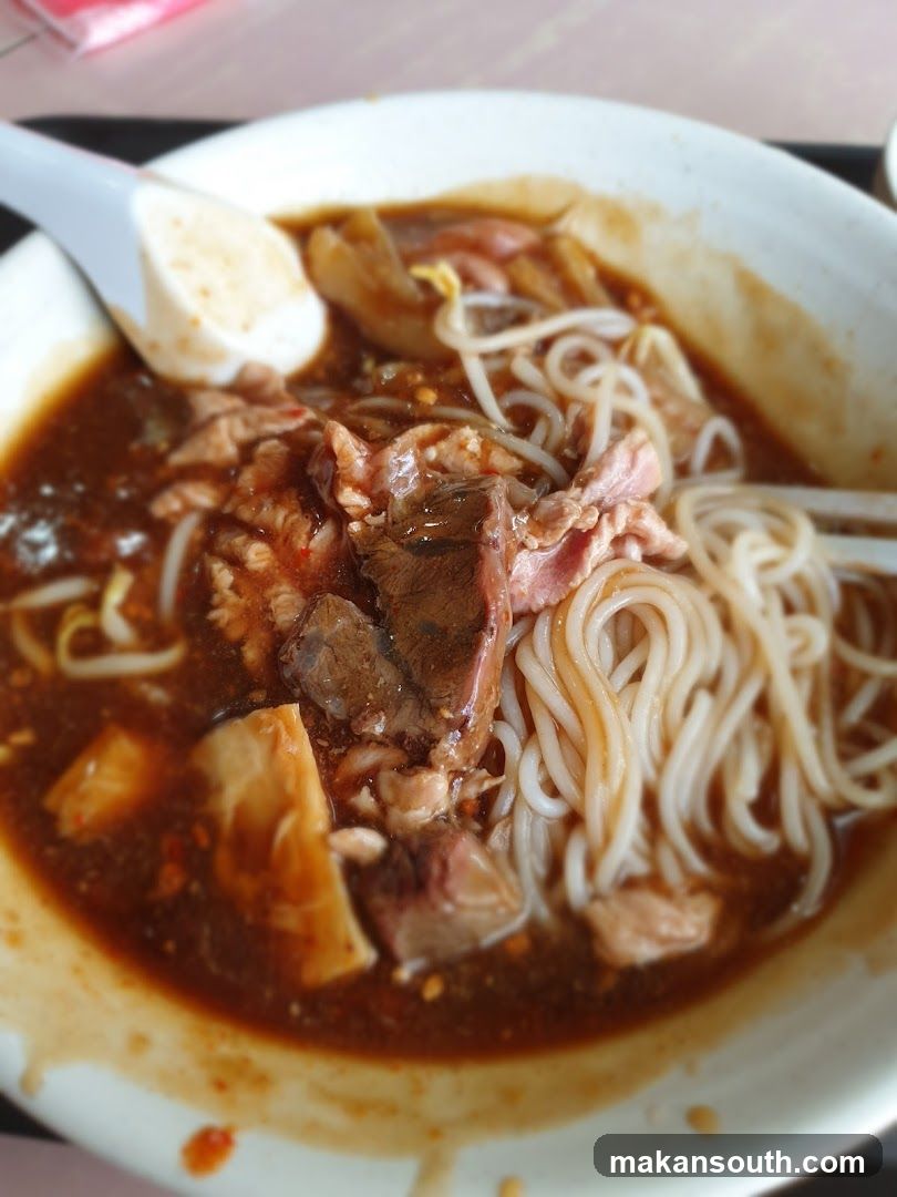 Bowl of Noodles with Meat and Soy Sauce