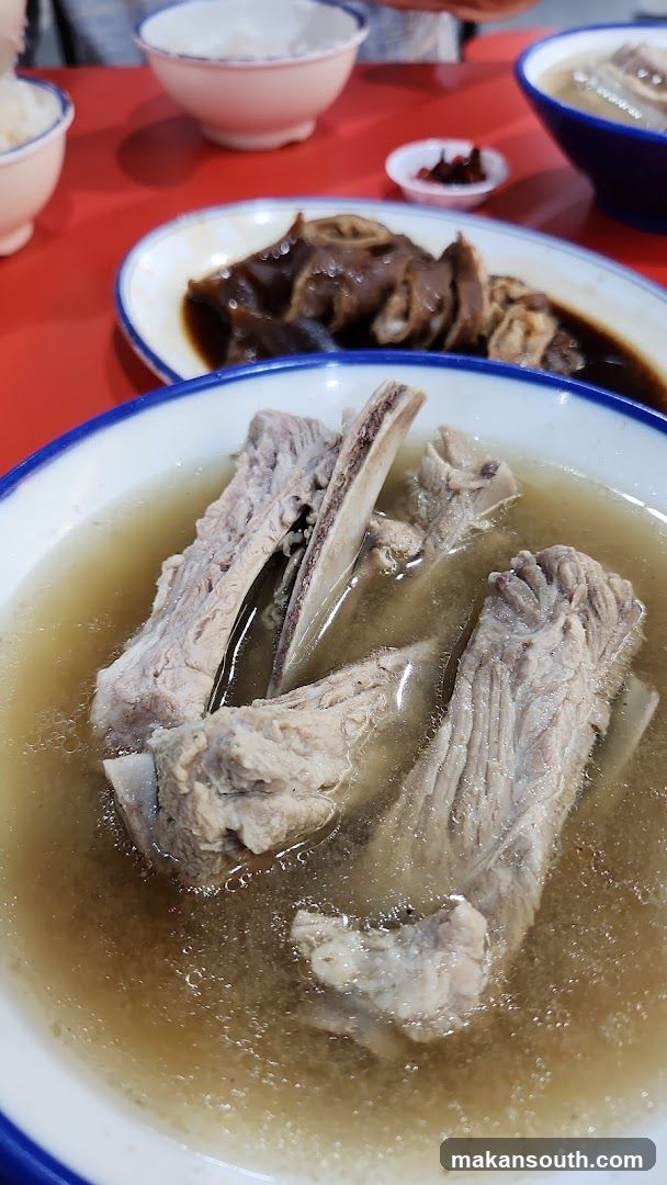 Bowl of Meat Soup with Side Dishes