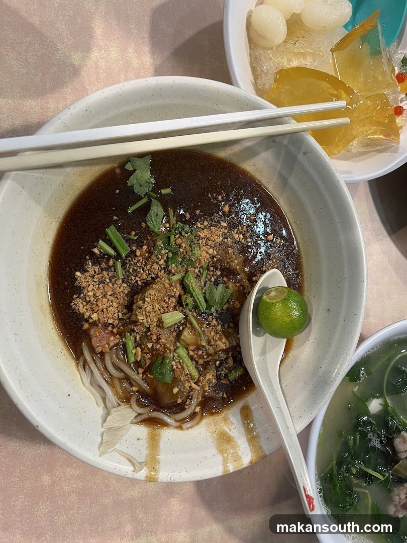 Bowl of Noodles with Sauce and Garnish