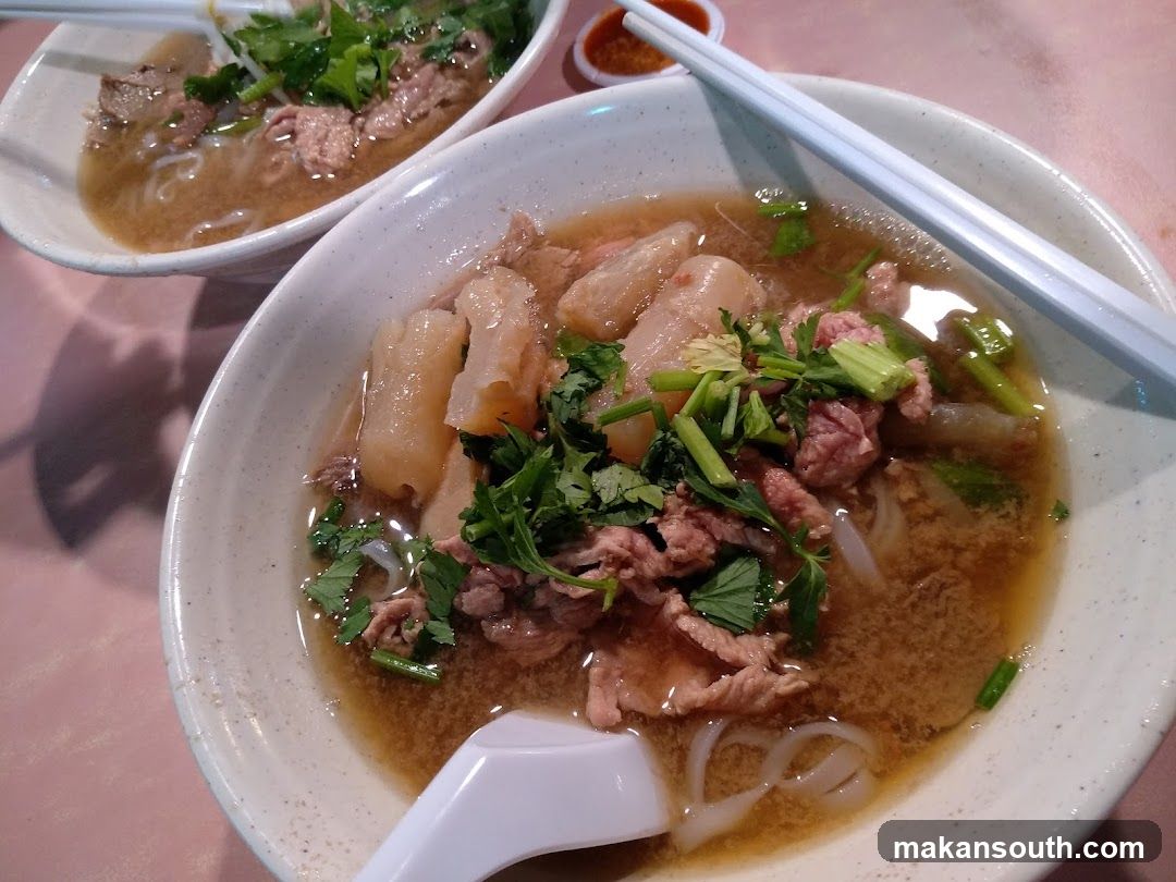 Bowl of Noodle Soup with Meat and Herbs