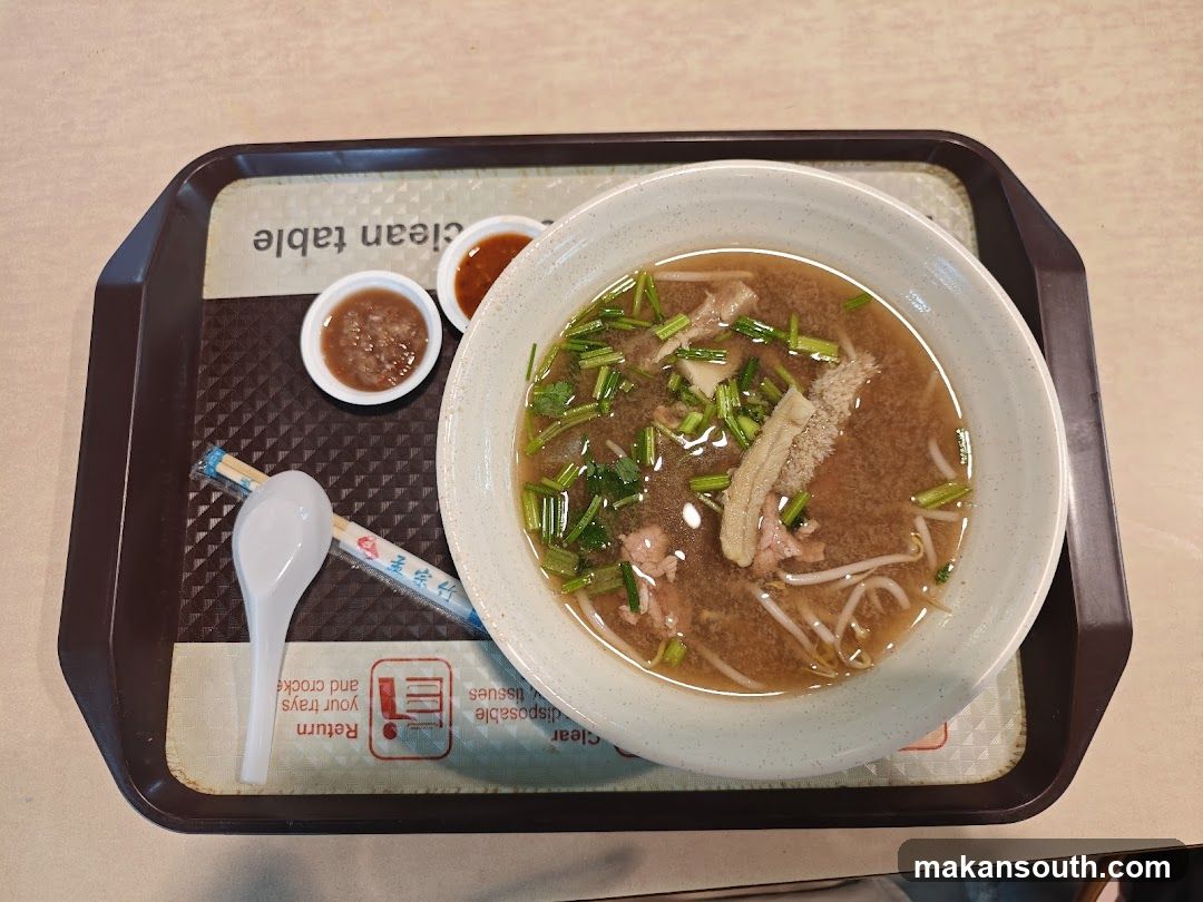 Bowl of Noodle Soup with Condiments