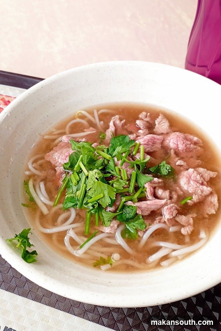 Bowl of Noodle Soup with Meat and Cilantro