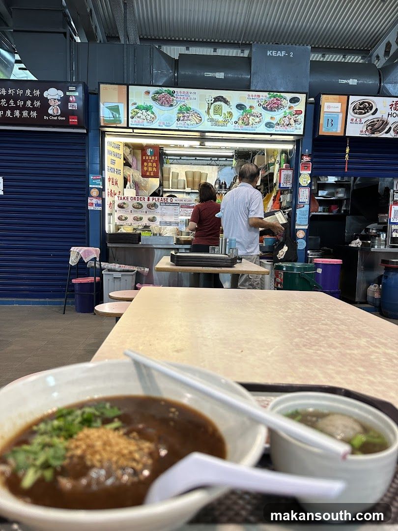 Food stall interior with bowls in foreground