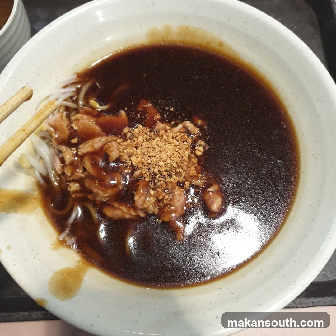 Bowl of Noodles with Sauce and Toppings