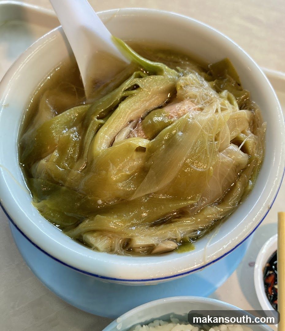 Bowl of Soup with Preserved Vegetables and Chicken