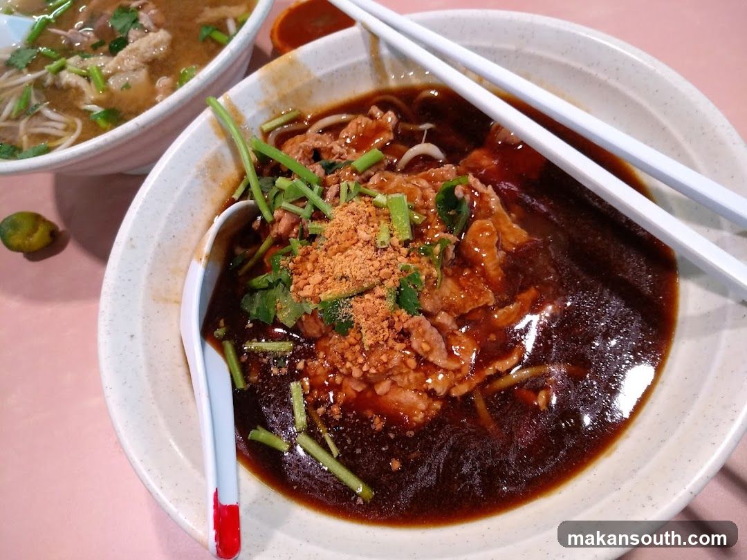 Bowl of Noodles with Sauce and Garnish
