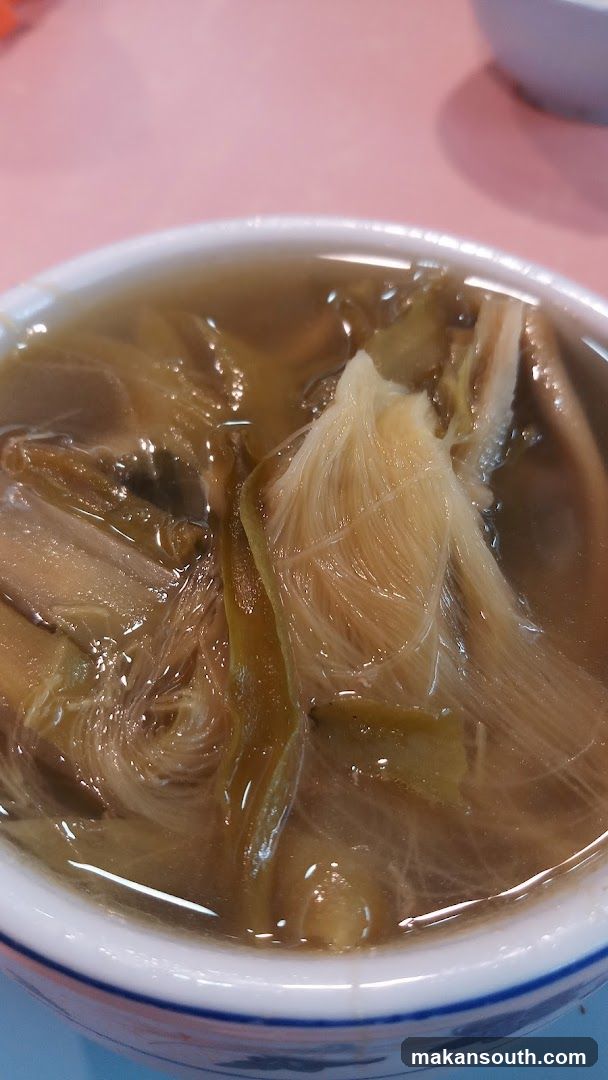 Bowl of Soup with Noodles and Vegetables