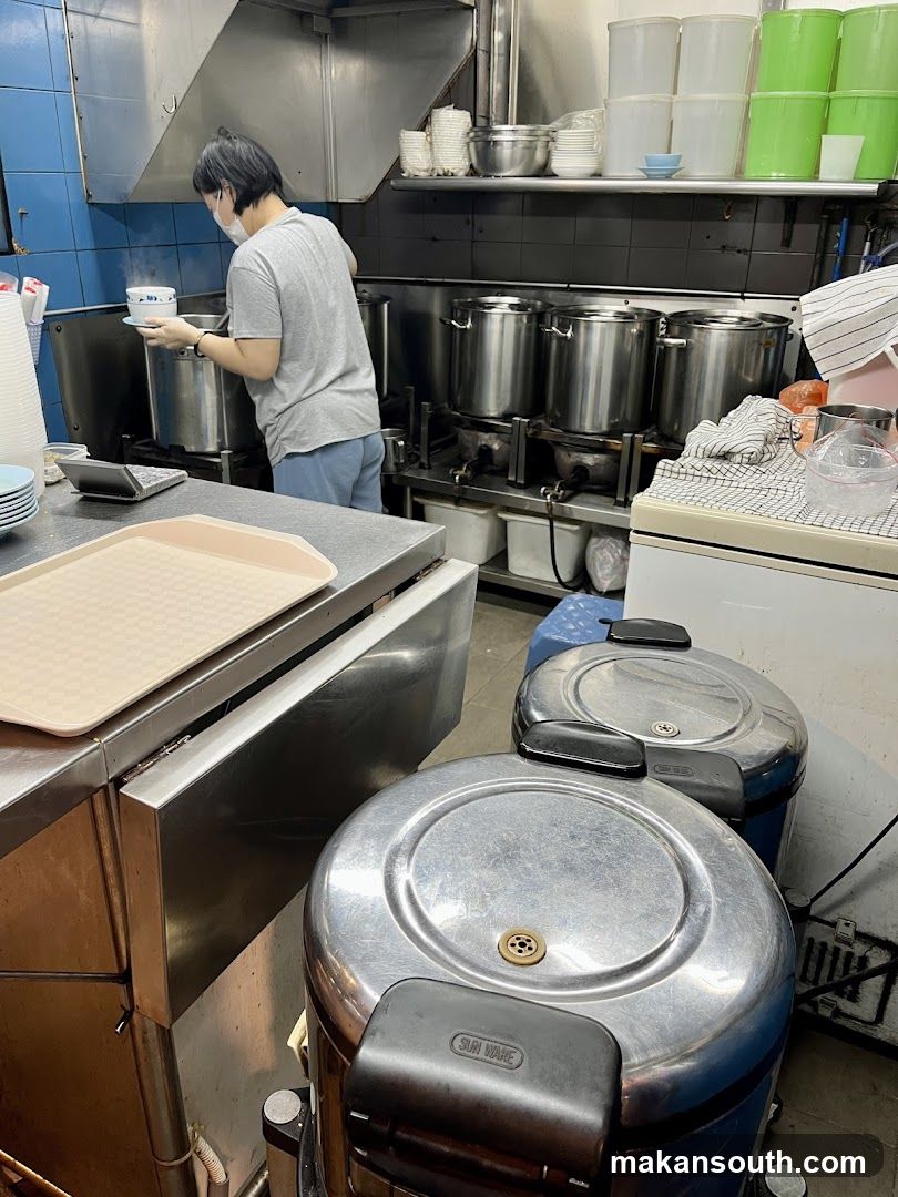 Kitchen Interior with Staff Cooking