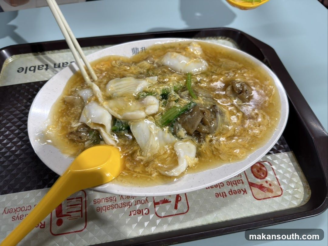 Noodle Dish with Chopsticks and Spoon