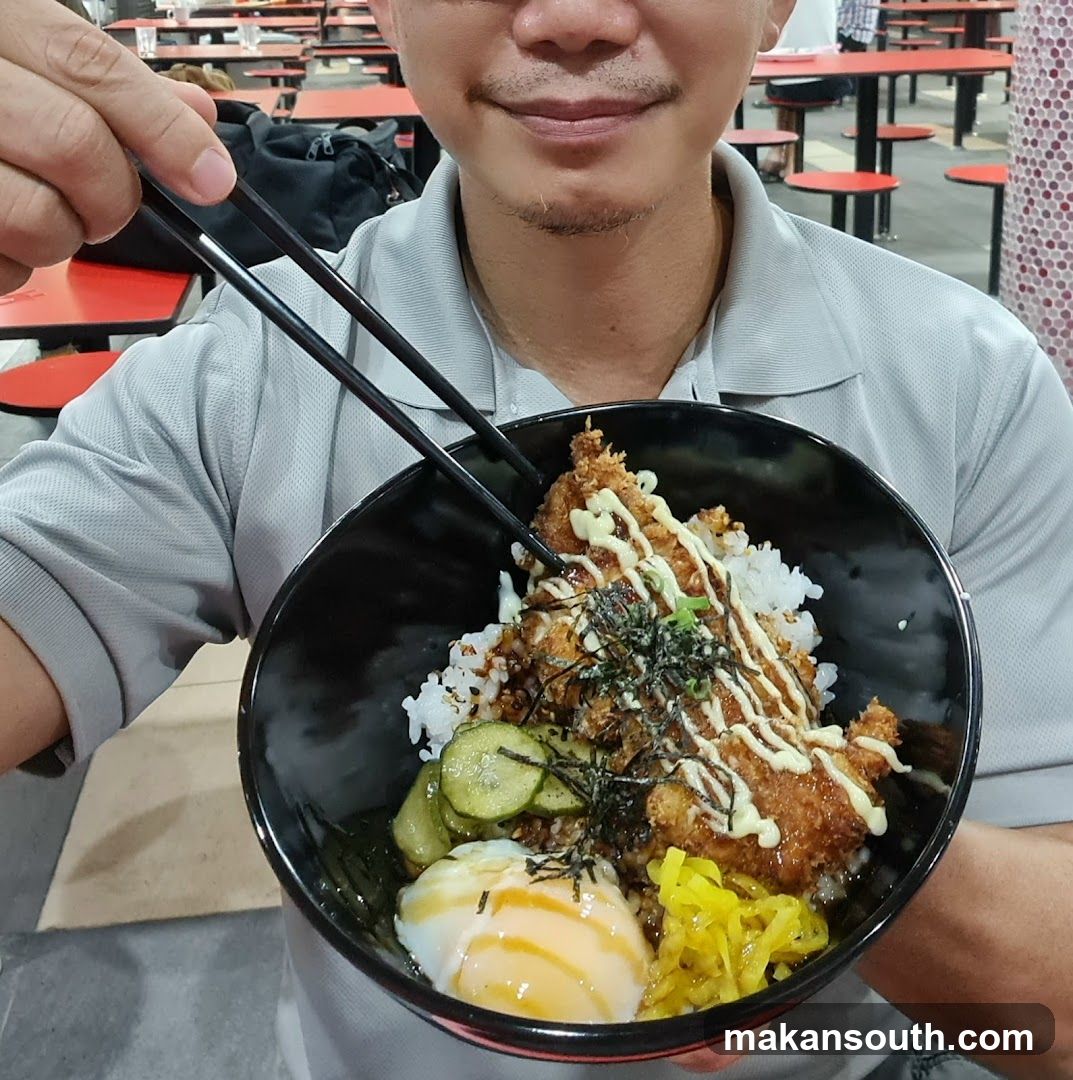 Person holding a bowl of food