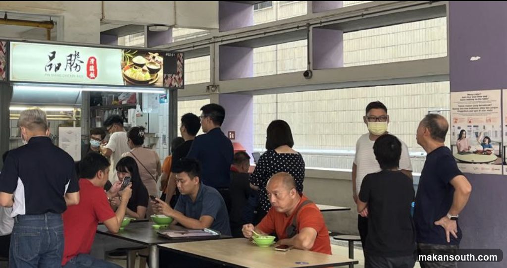 People eating at a food stall