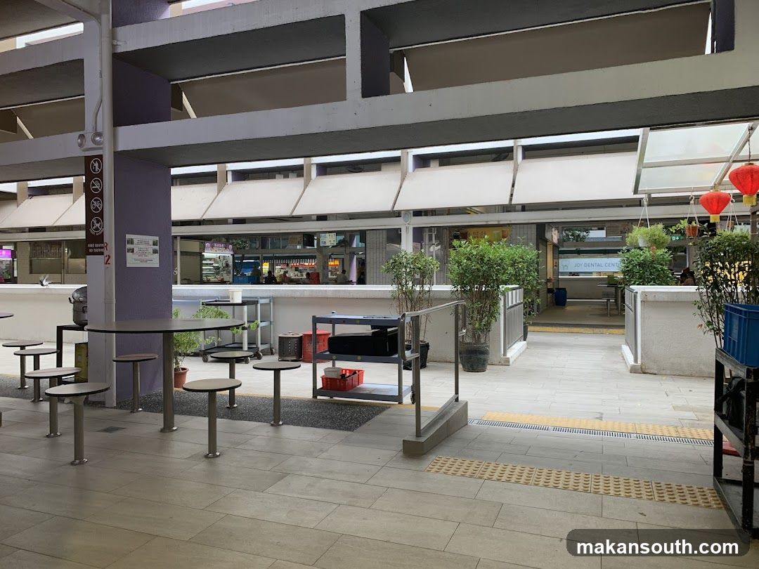 Outdoor Seating Area with Food Stalls