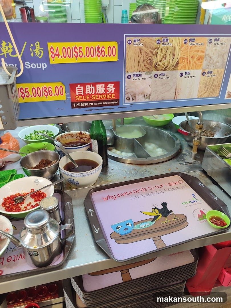 Food stall with noodle options and prices