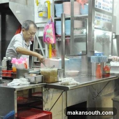 Food stall vendor preparing food