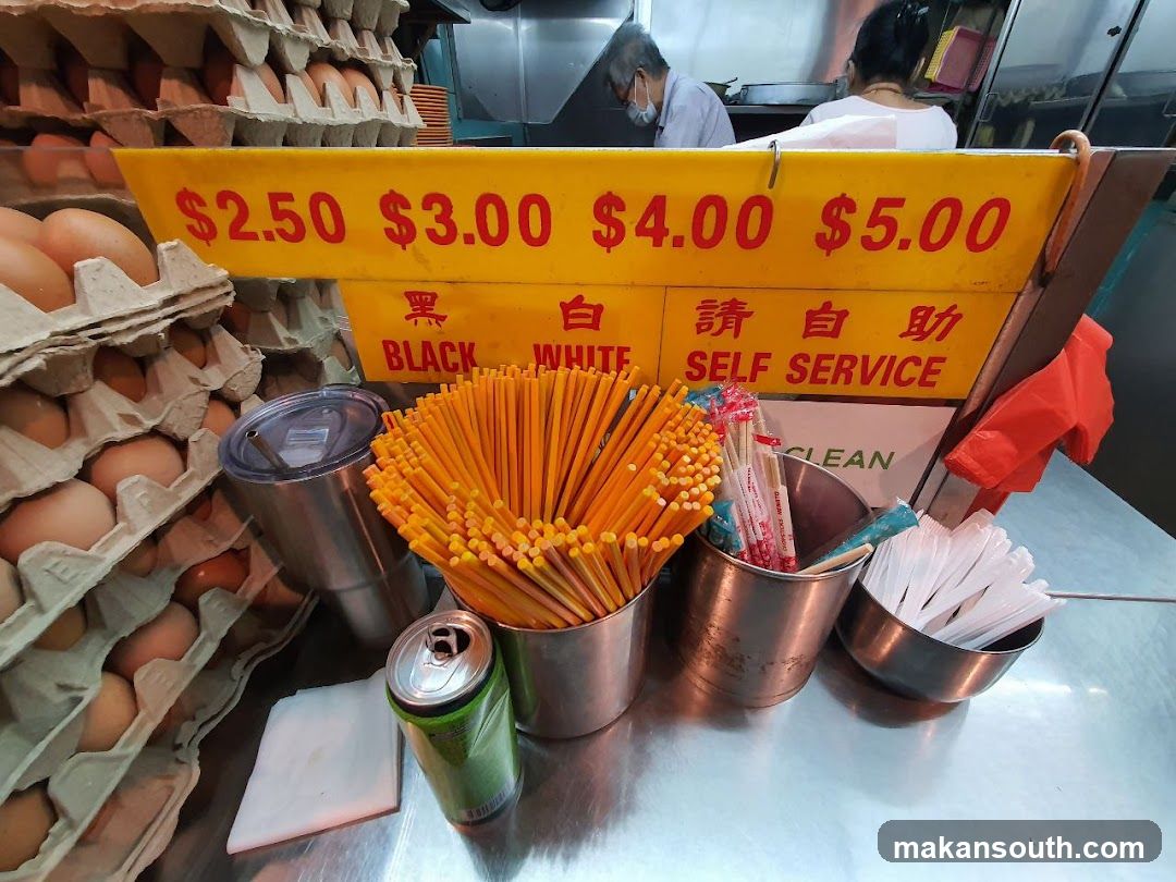 Self-service food stall with eggs and utensils