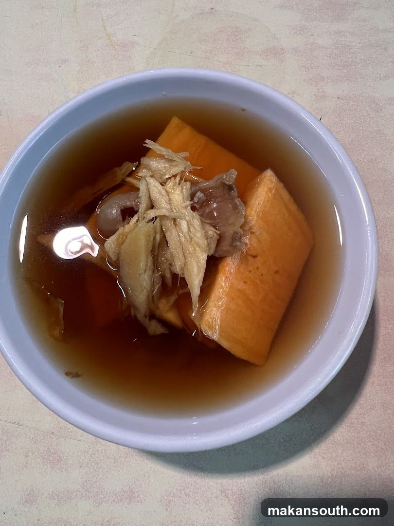 Bowl of soup with meat and vegetables