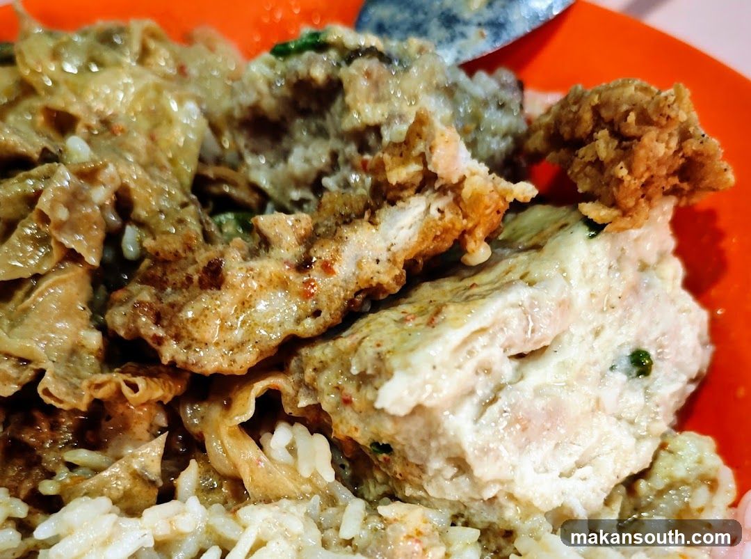 Close-up of a dish with rice and fried items