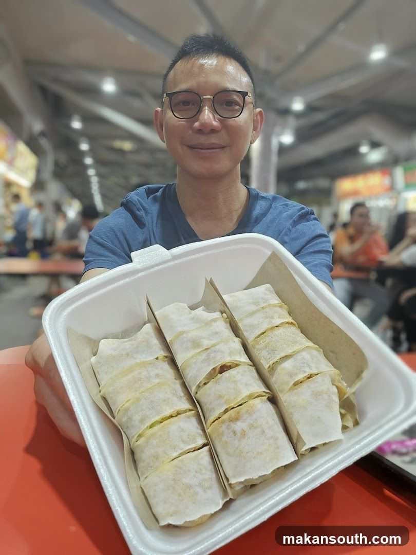 Man holding spring rolls
