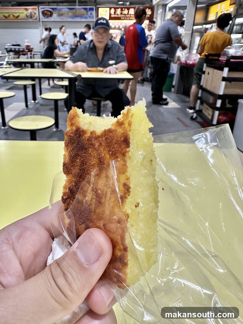 Food court with people and a slice of cake