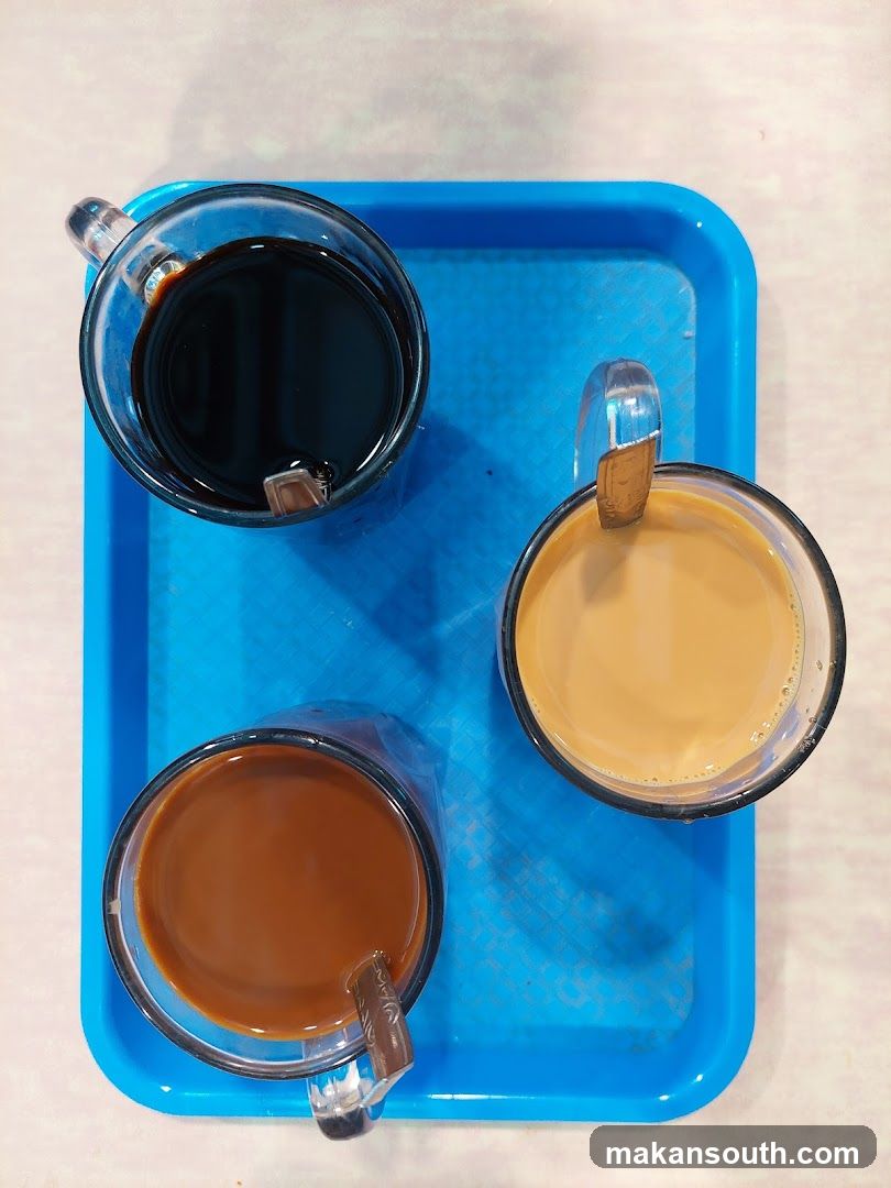 Three cups of coffee on a tray