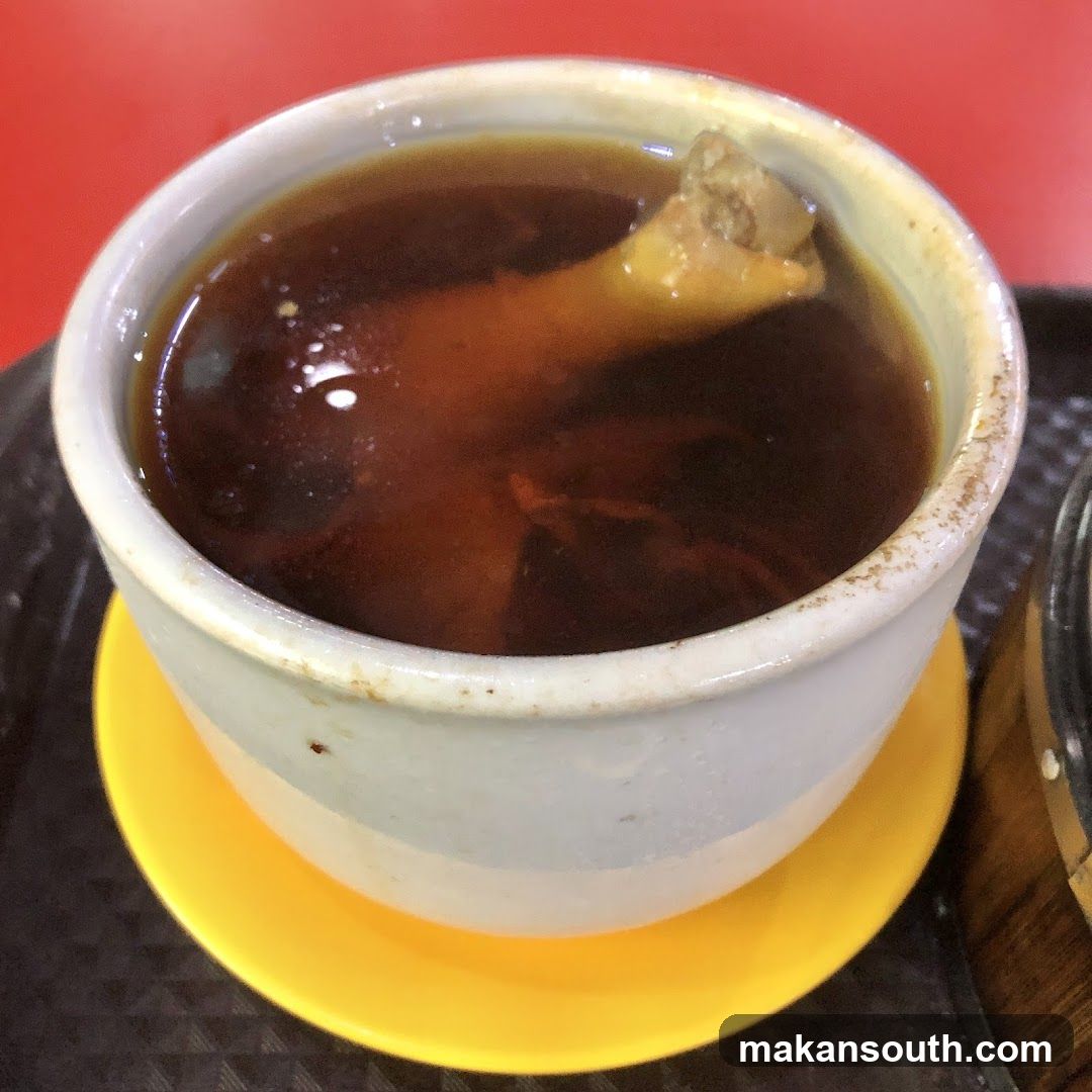 Bowl of soup with bone