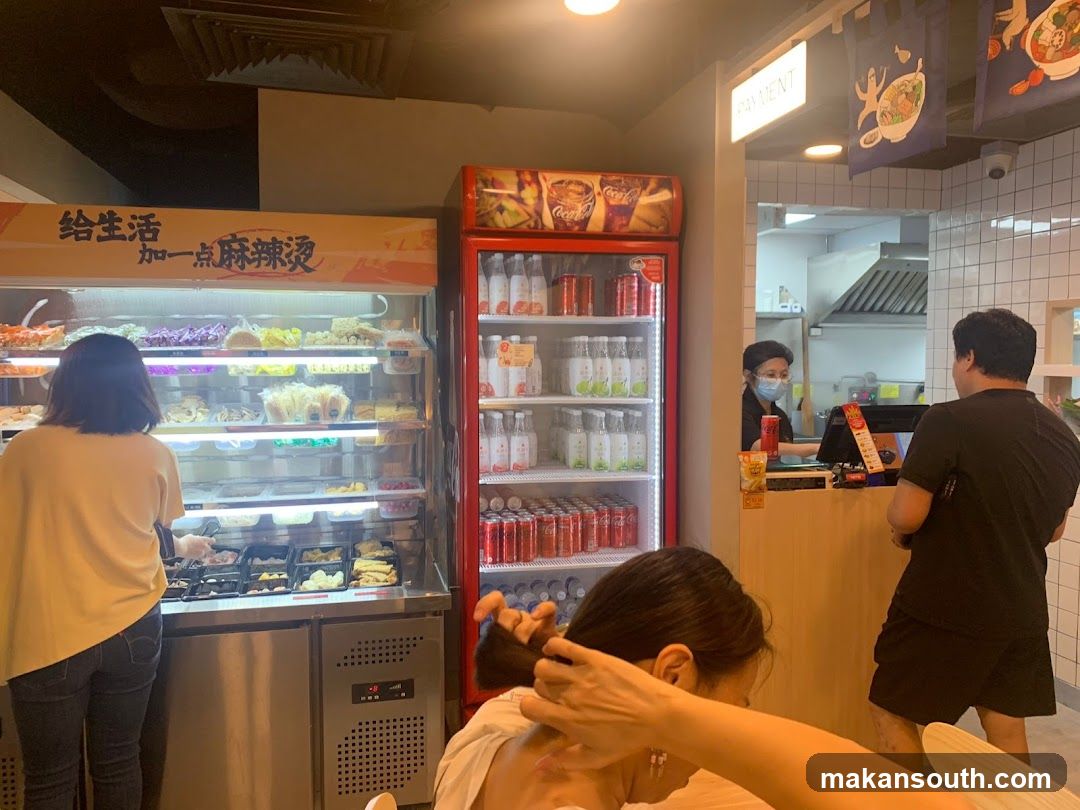 Restaurant Interior with Food Display and Payment Counter