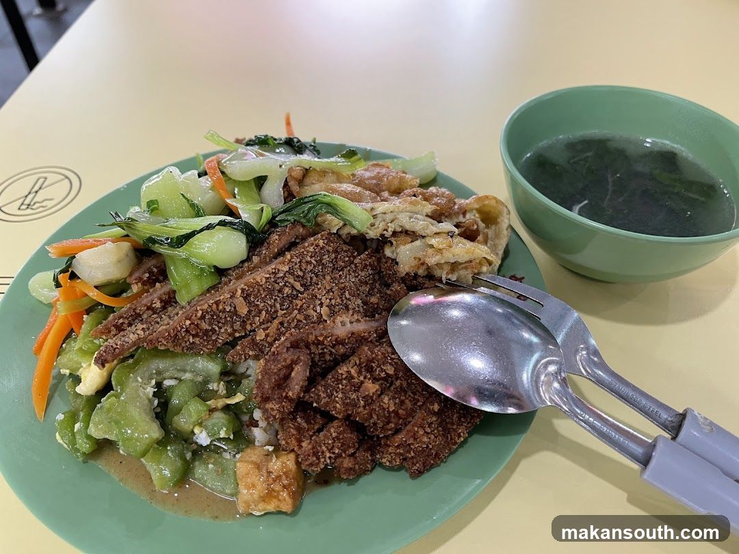 Rice dish with fried meat and vegetables
